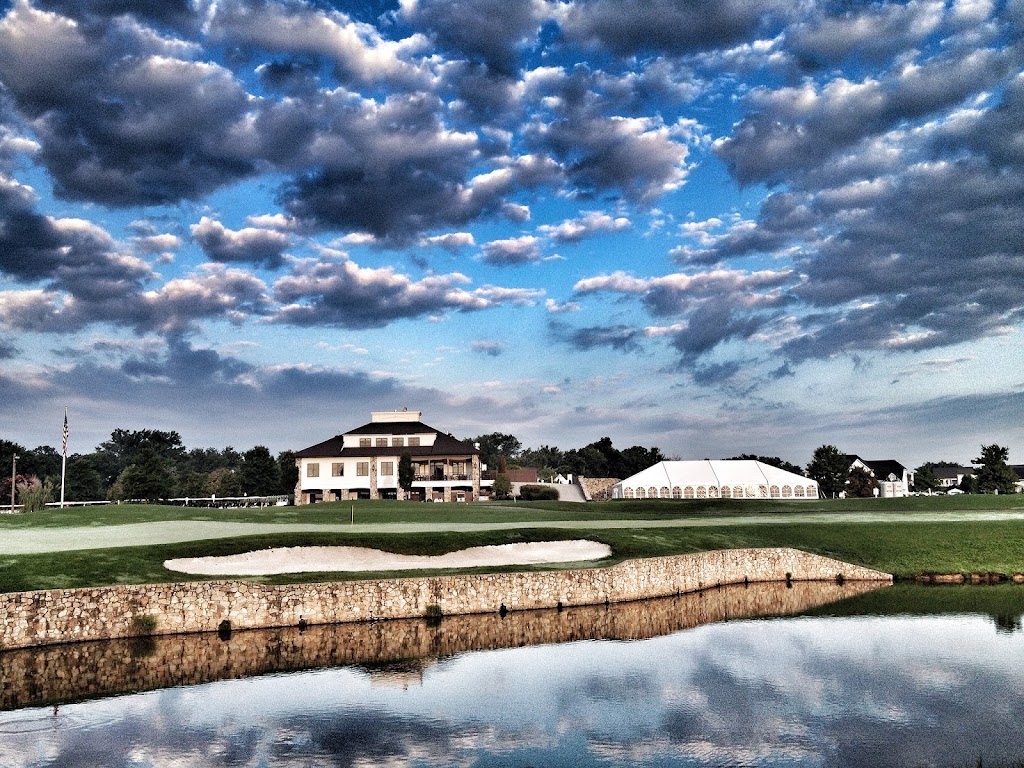Panoramic view of a lush green golf course at Town & Country Golf Links. Smooth