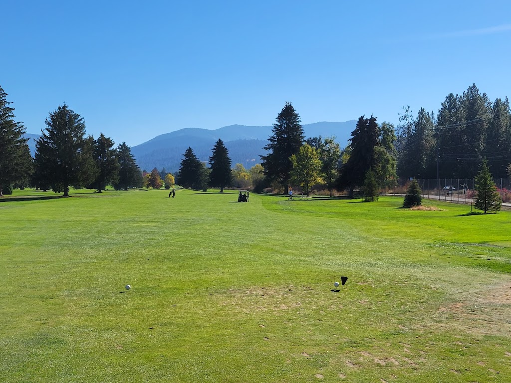 Panoramic view of a lush green golf course at Trailhead Golf Course. Smooth