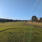 Panoramic view of a lush green golf course at Tregaron Golf Course. Smooth