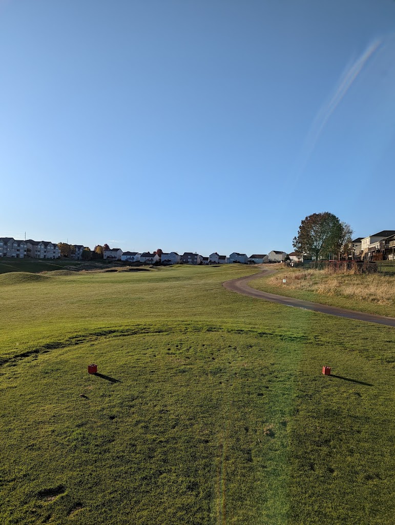 Panoramic view of a lush green golf course at Tregaron Golf Course. Smooth