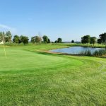 Panoramic view of a lush green golf course at Trempealeau Mountain Golf Club. Smooth
