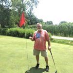 green grass with the flag in the hole.