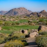 Panoramic view of a lush green golf course at Troon North Golf Club. Smooth