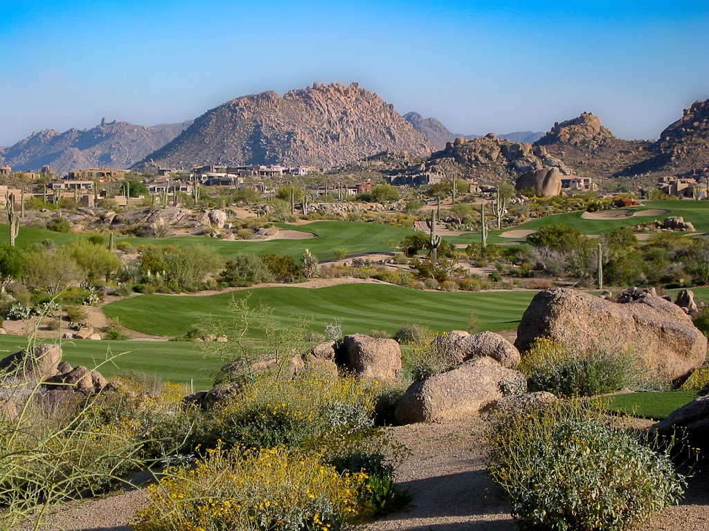 Panoramic view of a lush green golf course at Troon North Golf Club. Smooth