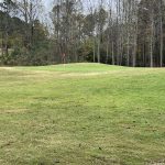 Panoramic view of a lush green golf course at Trophy Club of Apalachee. Smooth