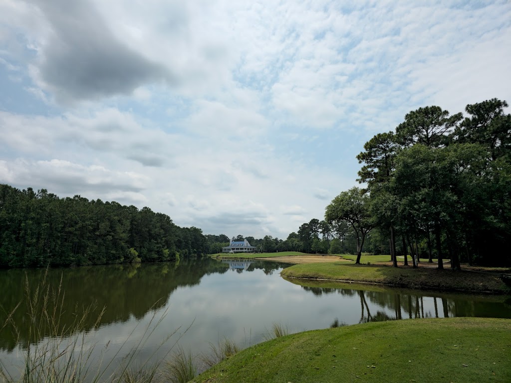 Panoramic view of a lush green golf course at True Blue Golf Club. Smooth