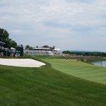 green grass with the flag in the hole.