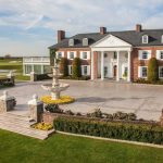 Panoramic view of a lush green golf course at Trump National Golf Club Bedminster. Smooth
