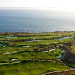 Panoramic view of a lush green golf course at Trump National Golf Club Los Angeles. Smooth