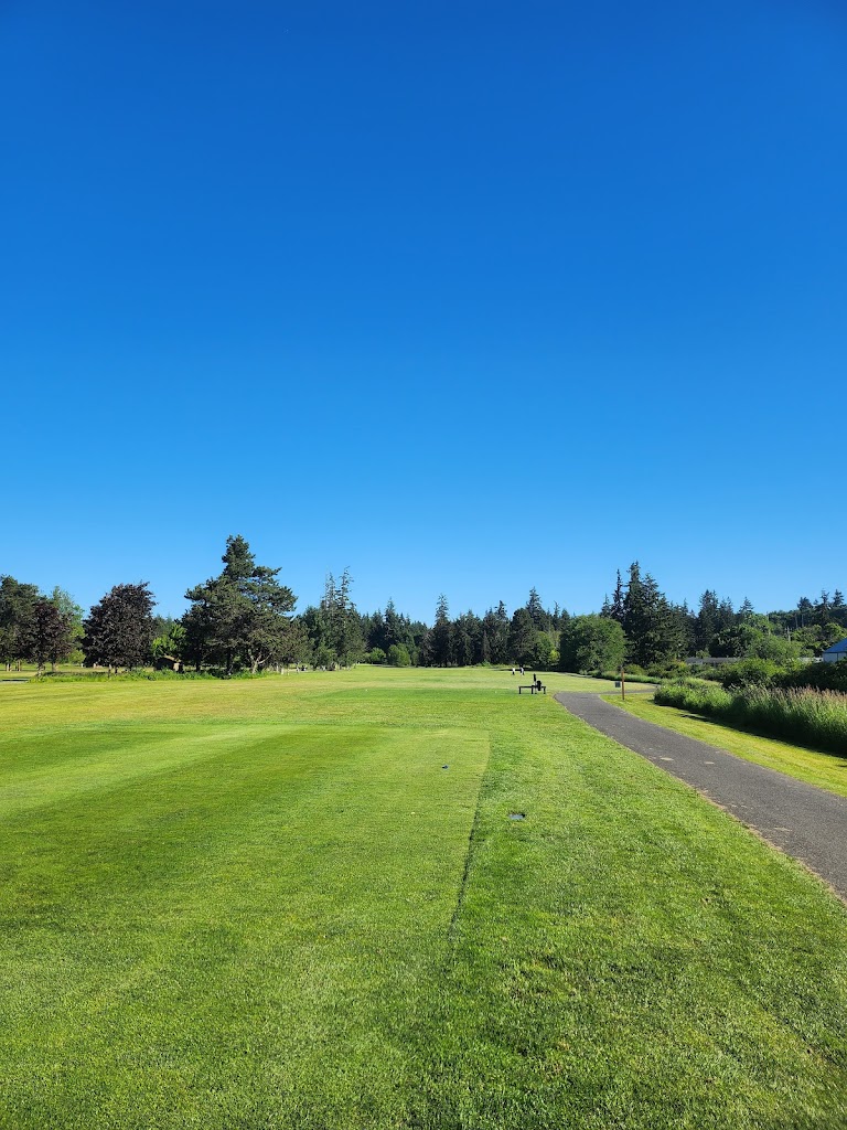 Panoramic view of a lush green golf course at Tumwater Valley Golf Club. Smooth