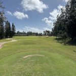 Panoramic view of a lush green golf course at Turtle Bay Golf. Smooth