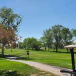 Panoramic view of a lush green golf course at Twin Falls Golf Course. Smooth