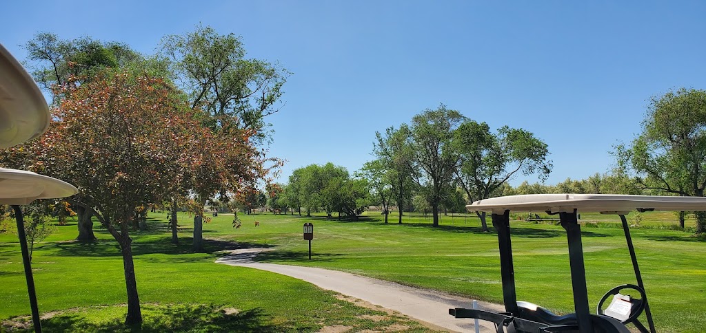 Panoramic view of a lush green golf course at Twin Falls Golf Course. Smooth