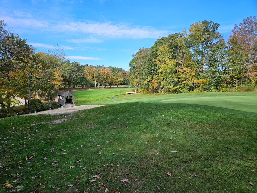 Panoramic view of a lush green golf course at Twin Hills Country Club. Smooth
