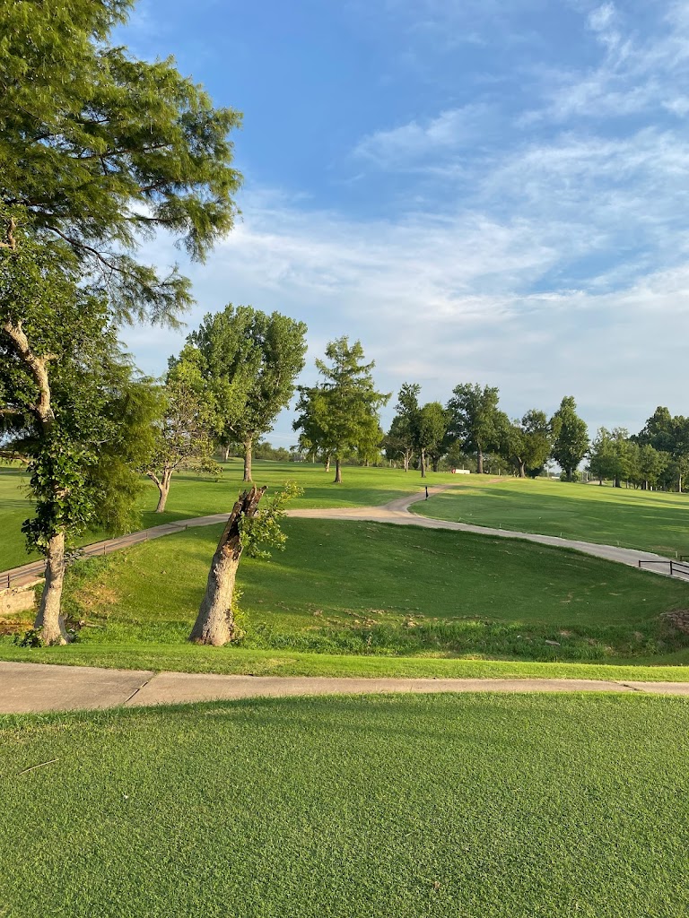 Panoramic view of a lush green golf course at Twin Hills Golf & Country Club. Smooth