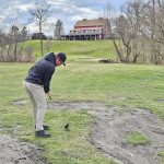 green grass with the flag in the hole.