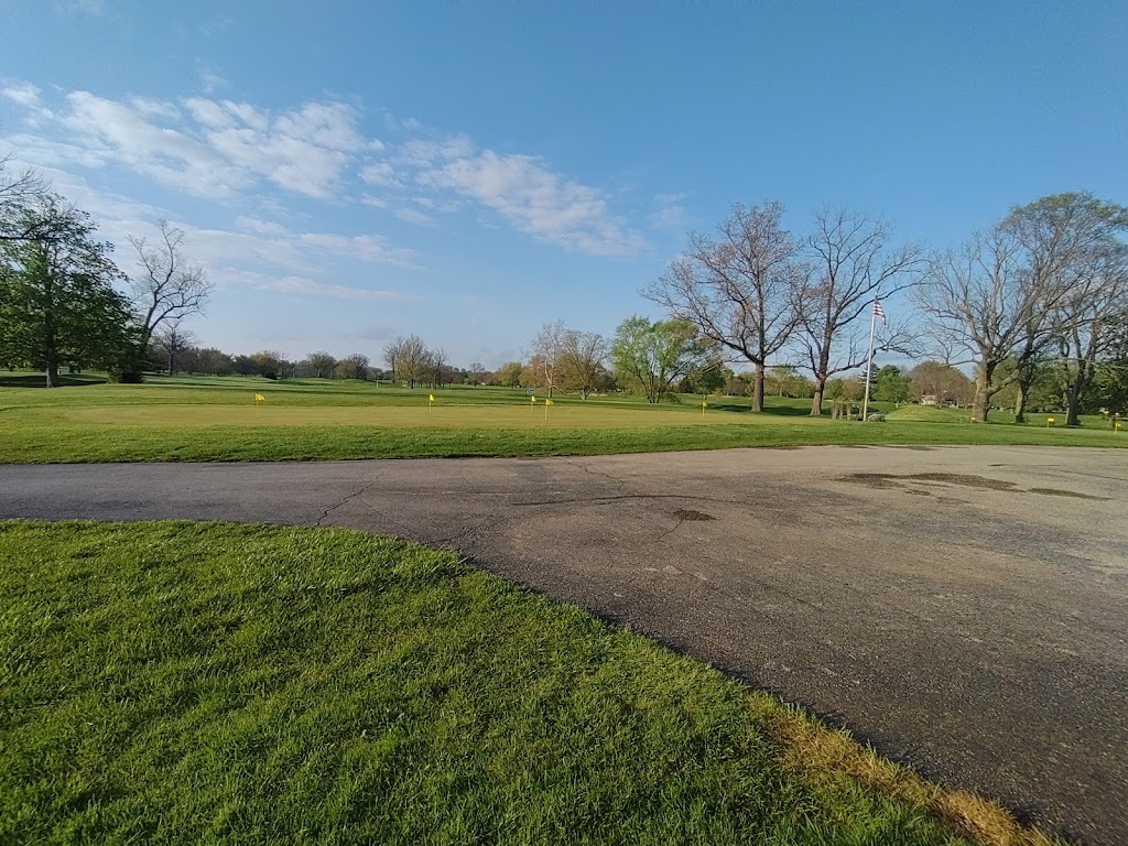 Panoramic view of a lush green golf course at Twin Lakes Golf Club. Smooth
