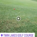 green grass with the flag in the hole.