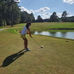Panoramic view of a lush green golf course at Twin Lakes Golf Course. Smooth
