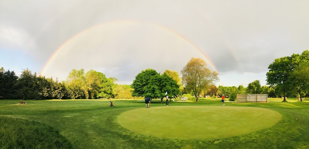 Panoramic view of a lush green golf course at Twin Willows Par 3 Golf. Smooth