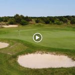 green grass with the flag in the hole.
