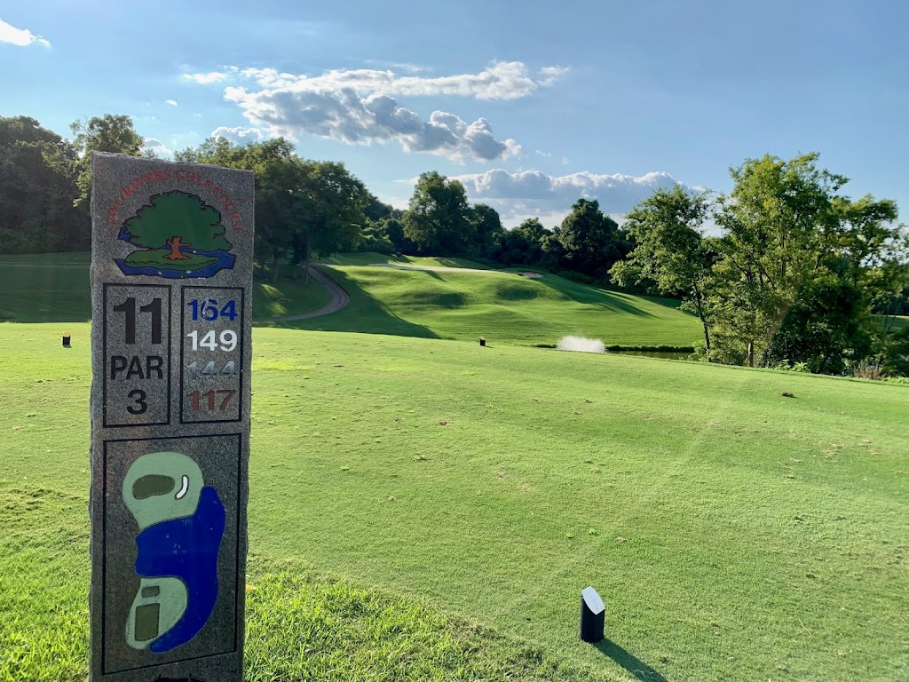 Panoramic view of a lush green golf course at Two Rivers Golf Course. Smooth