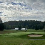 Panoramic view of a lush green golf course at Tygart Lake Public Golf Course. Smooth