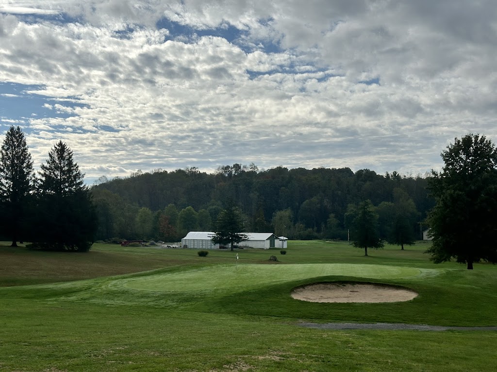 Panoramic view of a lush green golf course at Tygart Lake Public Golf Course. Smooth