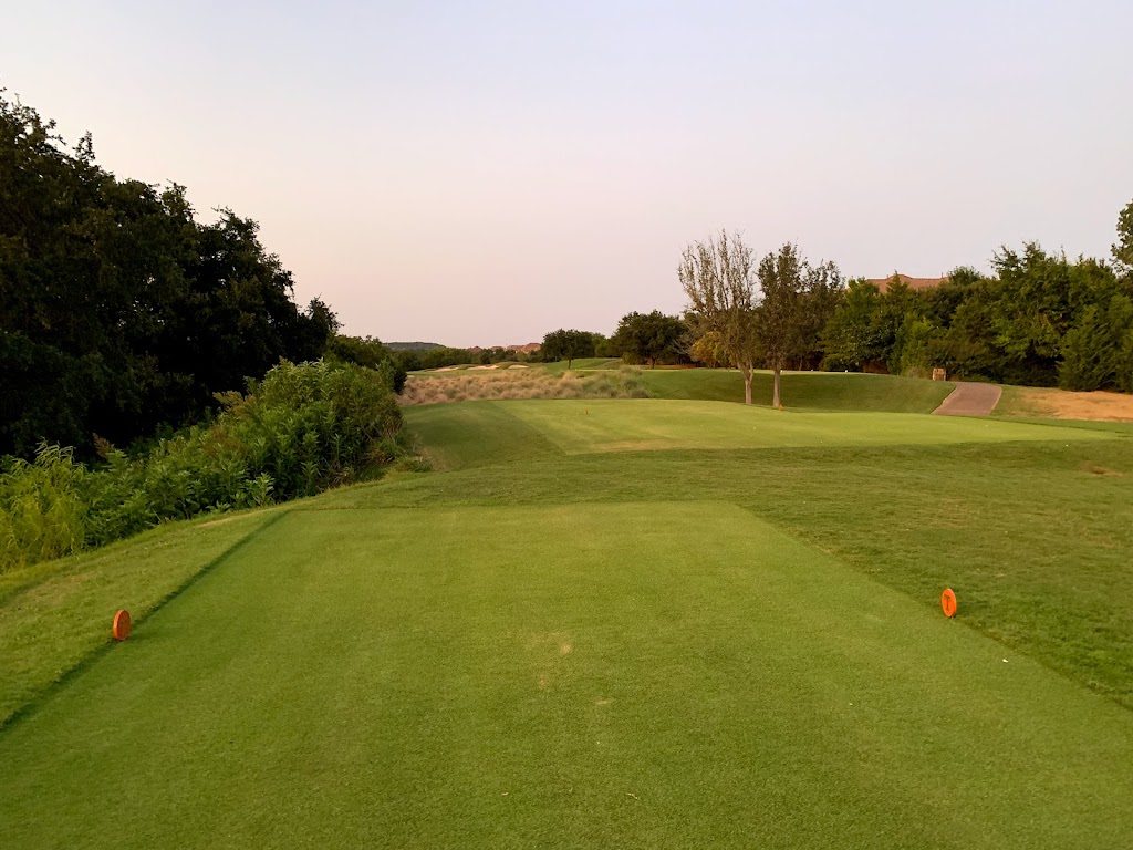 Panoramic view of a lush green golf course at UT Golf Club. Smooth
