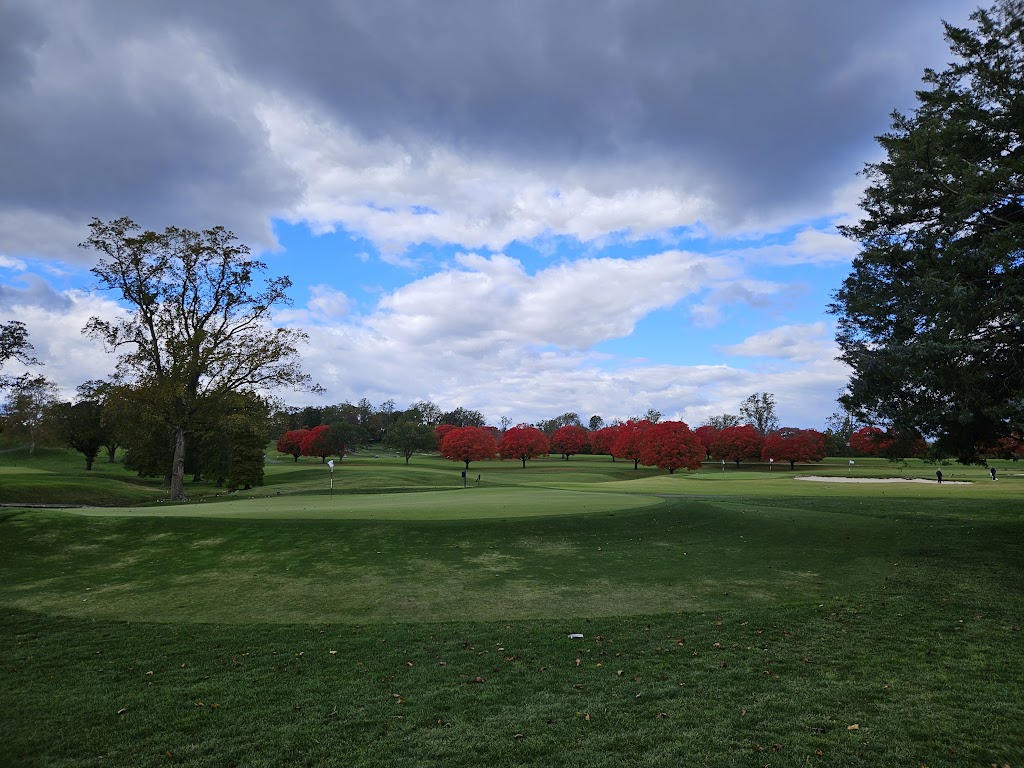 Panoramic view of a lush green golf course at United States Naval Academy Golf Club. Smooth