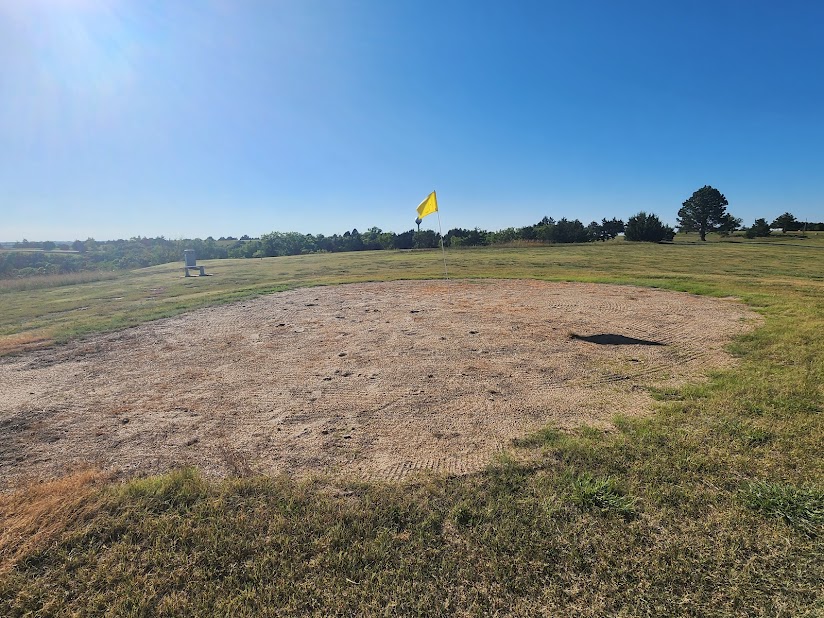 Panoramic view of a lush green golf course at University Park Golf Course. Smooth