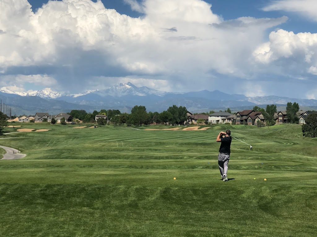 Panoramic view of a lush green golf course at Ute Creek Golf Course. Smooth