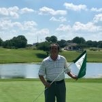 green grass with the flag in the hole.