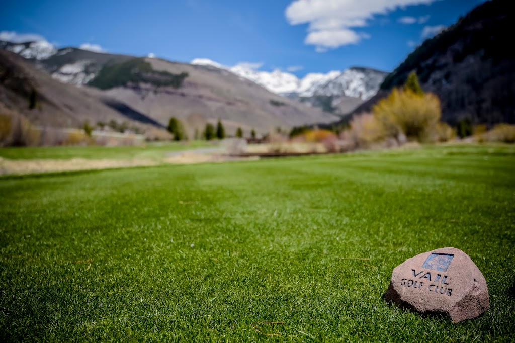 Panoramic view of a lush green golf course at Vail Golf Club. Smooth