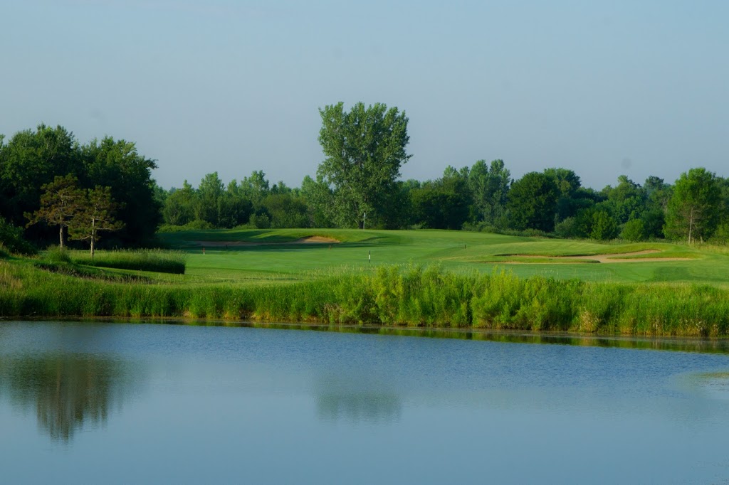 Panoramic view of a lush green golf course at Victory Links Golf Course. Smooth