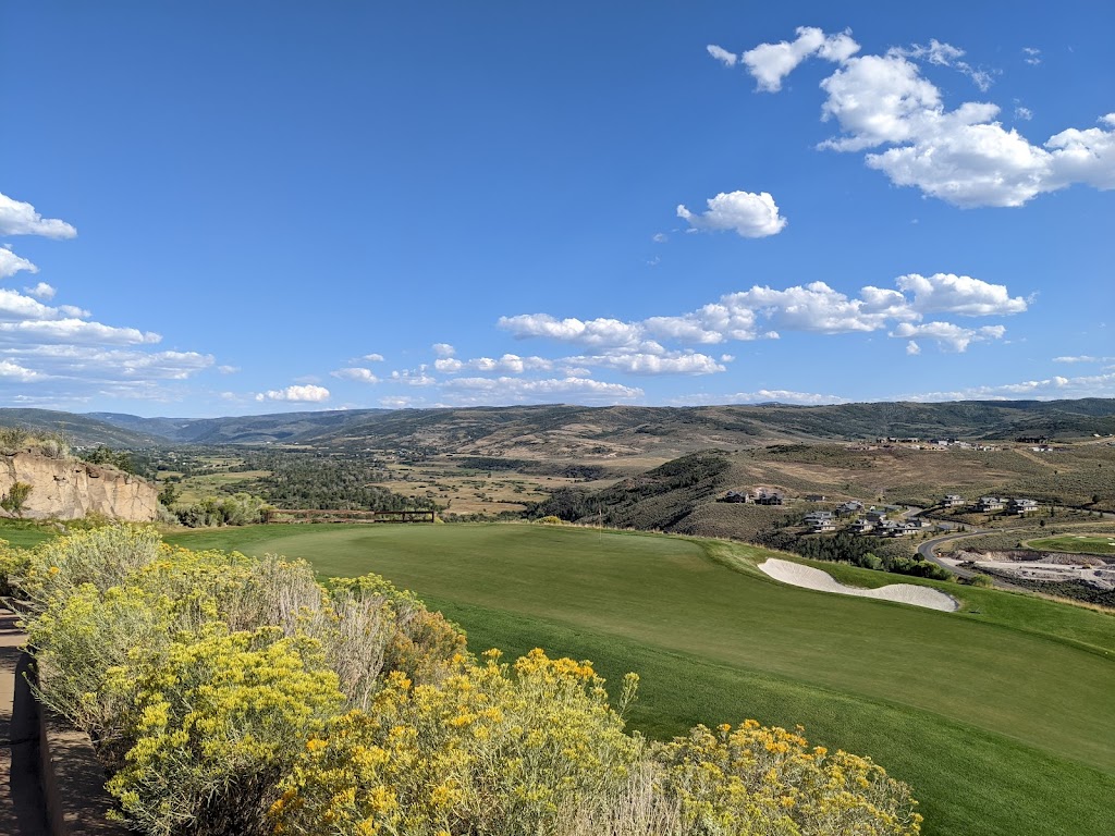 Panoramic view of a lush green golf course at Victory Ranch Golf Club. Smooth