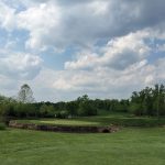 Panoramic view of a lush green golf course at Virginia Golf Center. Smooth