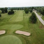 green grass with the flag in the hole.