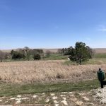 Panoramic view of a lush green golf course at Wabaunsee Pines Golf Course. Smooth