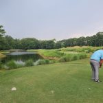 green grass with the flag in the hole.