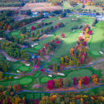 Panoramic view of a lush green golf course at Wachusett Country Club. Smooth