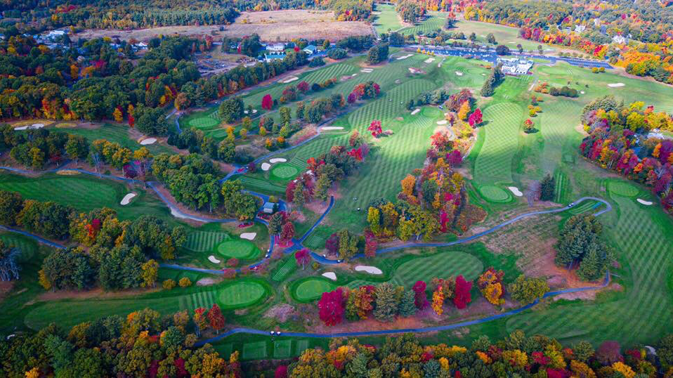 Panoramic view of a lush green golf course at Wachusett Country Club. Smooth