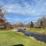 Panoramic view of a lush green golf course at Wahconah Country Club. Smooth