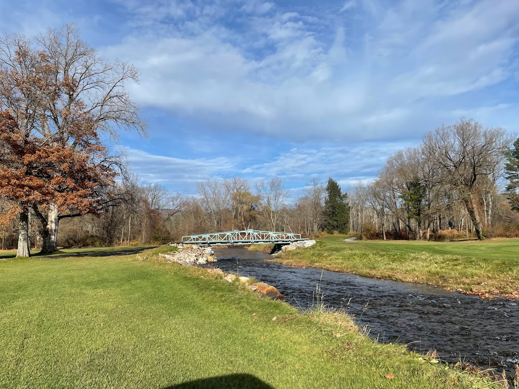 Panoramic view of a lush green golf course at Wahconah Country Club. Smooth
