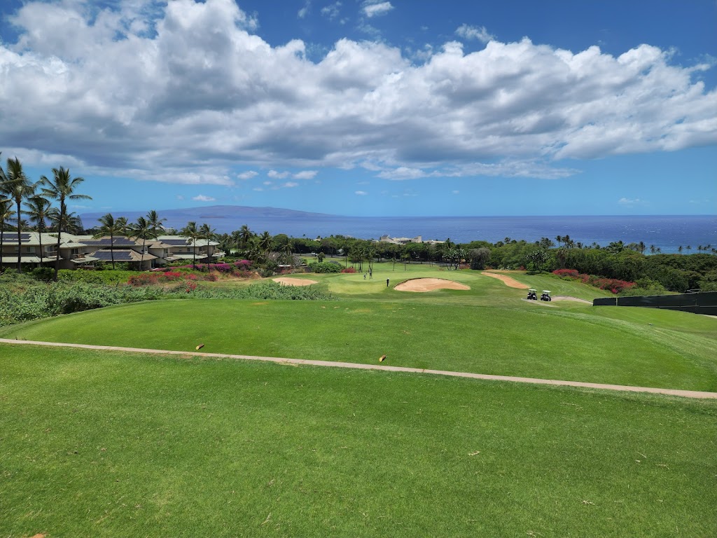 Panoramic view of a lush green golf course at Wailea Blue Golf Course. Smooth