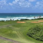 Panoramic view of a lush green golf course at Wailua Golf Course. Smooth