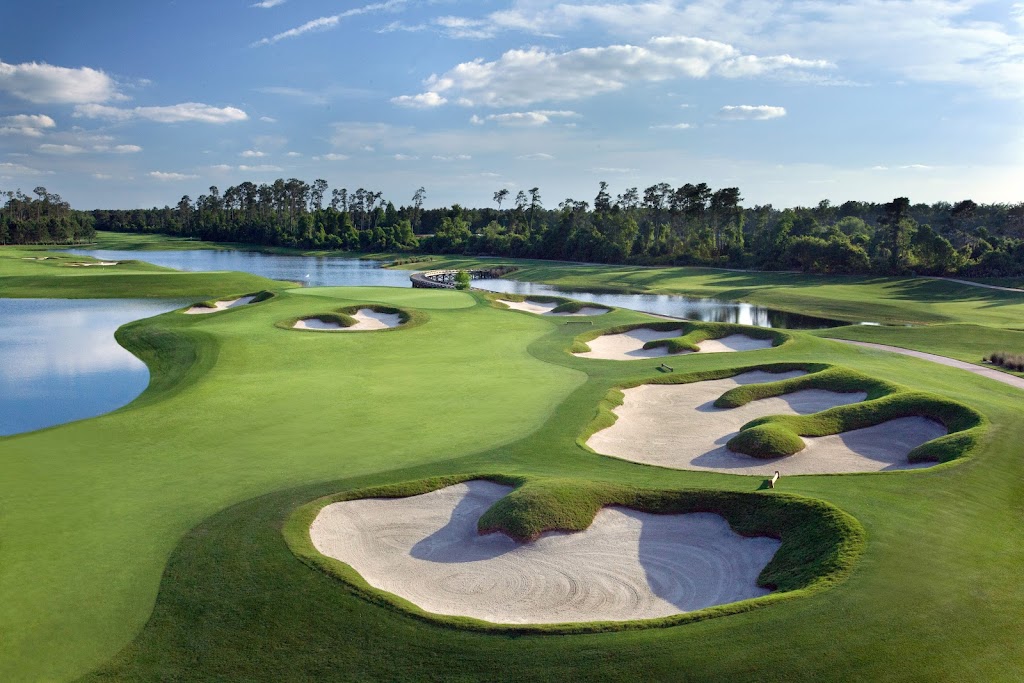 Panoramic view of a lush green golf course at Waldorf Astoria Golf Club. Smooth