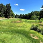 Panoramic view of a lush green golf course at Wallkill Golf Club. Smooth