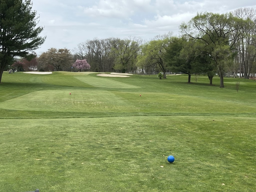 Panoramic view of a lush green golf course at Wash Township Golf Course. Smooth