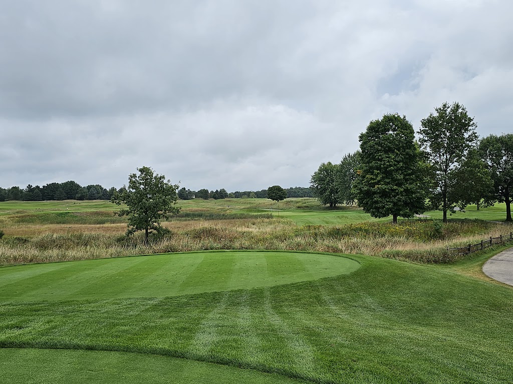 Panoramic view of a lush green golf course at Washington County Golf Course. Smooth